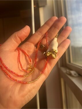 Delicate Red-Orange Seed Bead Necklace with Gold Accents and White shell Pendant